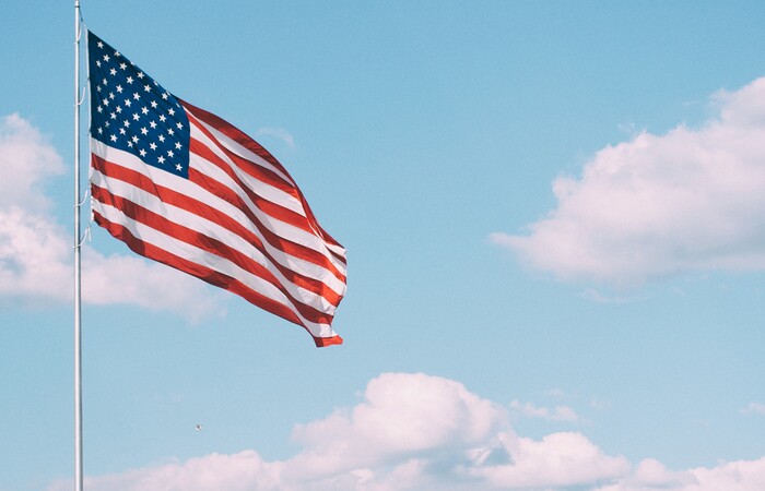 U.S. flag blowing in the wind.