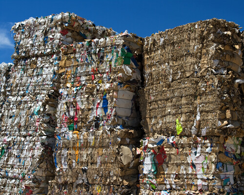 Bales of cardboard and paper ready to be recycled.