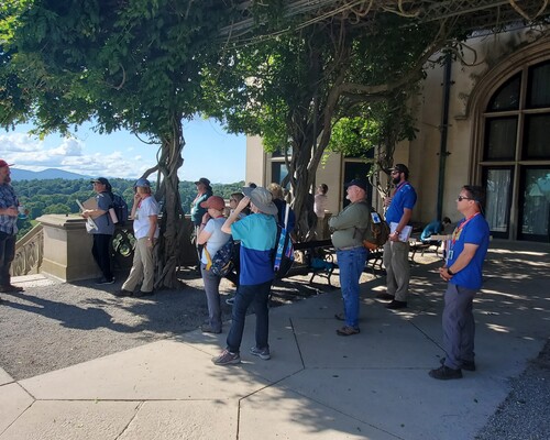 Blair Bishop explaining the history of the land to a group of people.