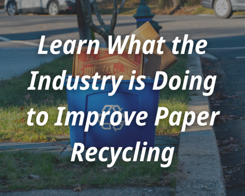 A pizza and cardboard box in a recycling bin. The text says learn what the industry is doing to improve paper recycling.