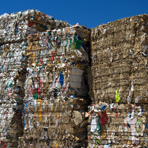 Bales of cardboard and paper ready to be recycled.