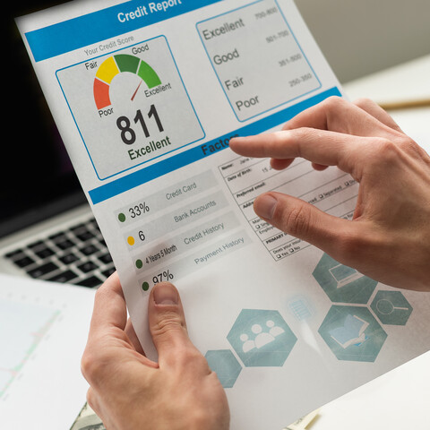 A person holding a paper credit report